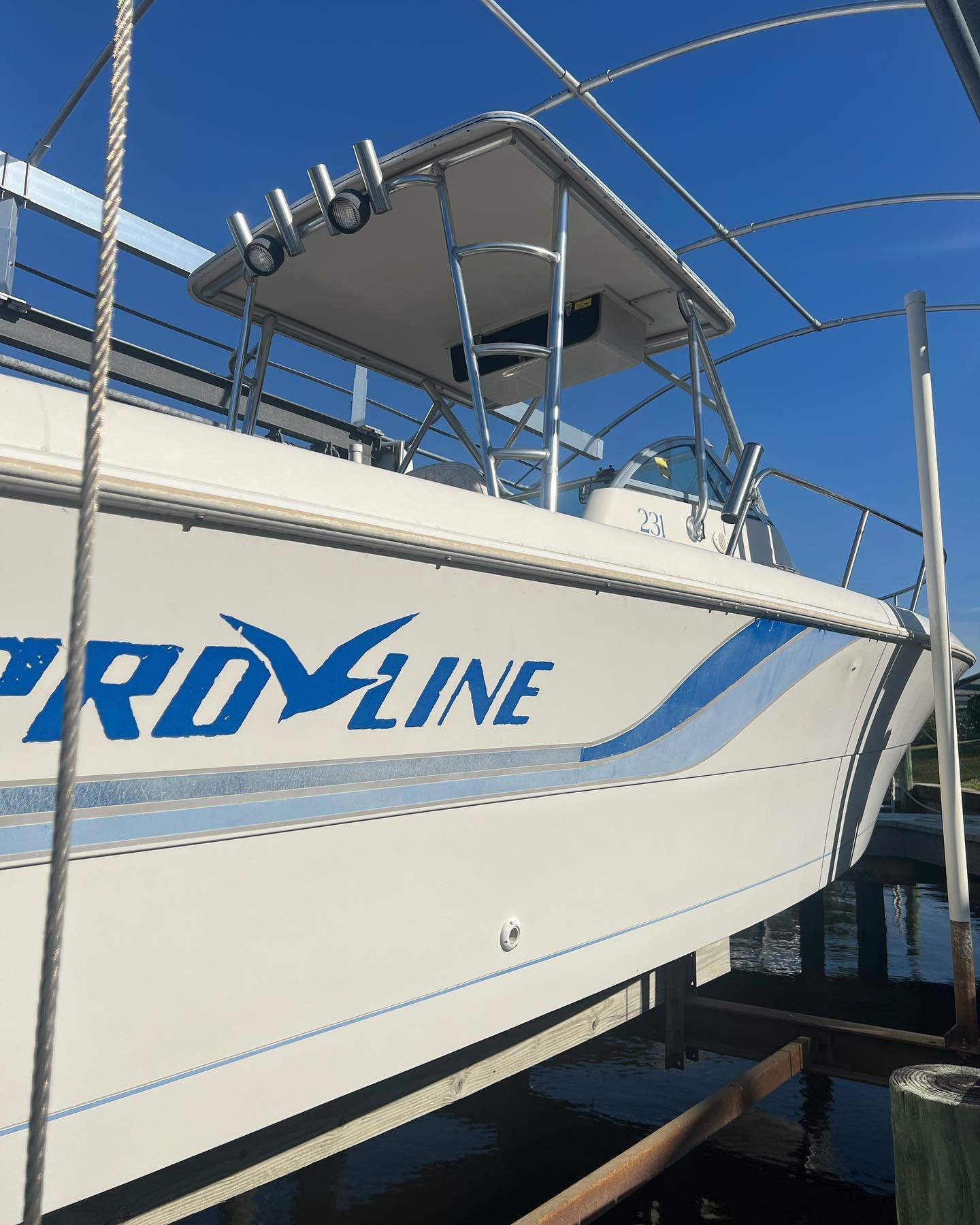 Pro-Line on a lift beside a residential canal