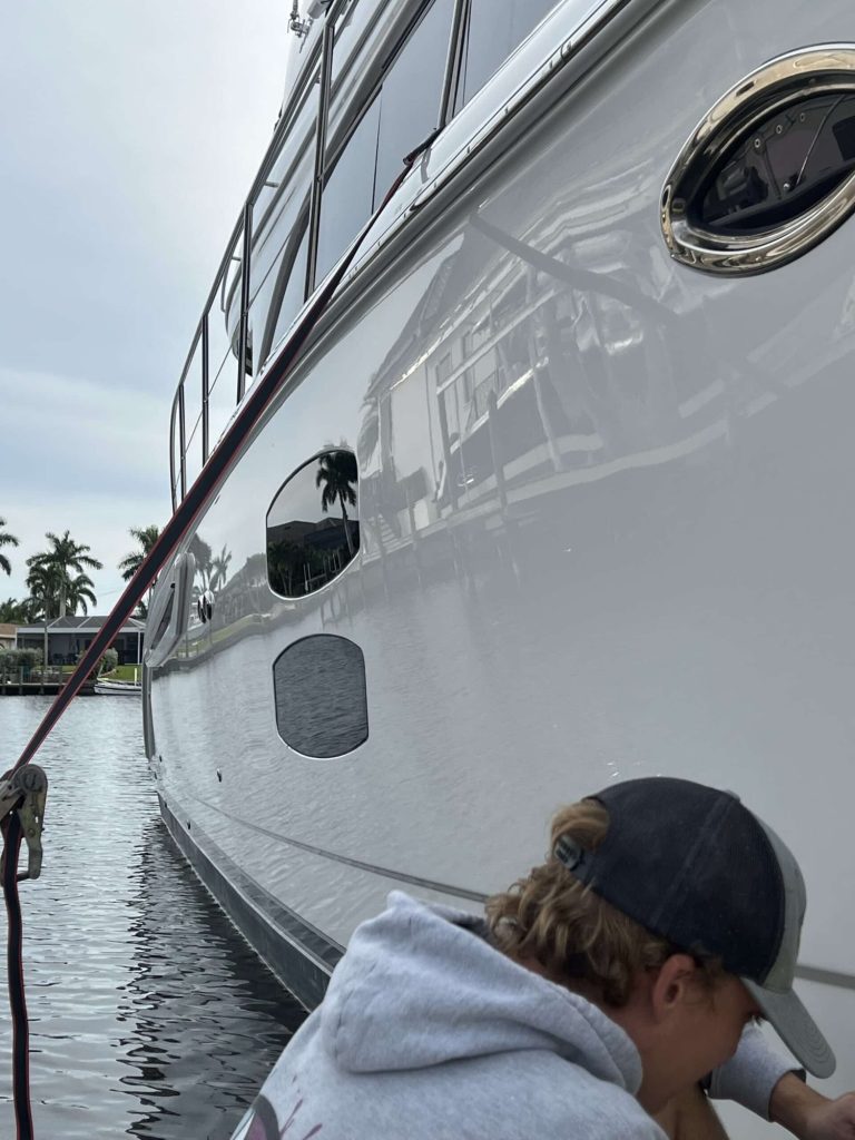 Crew member working along a hull