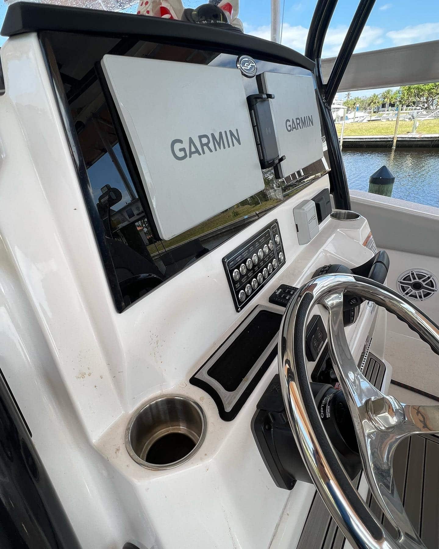 Dual Garmin displays and switch panel at a helm