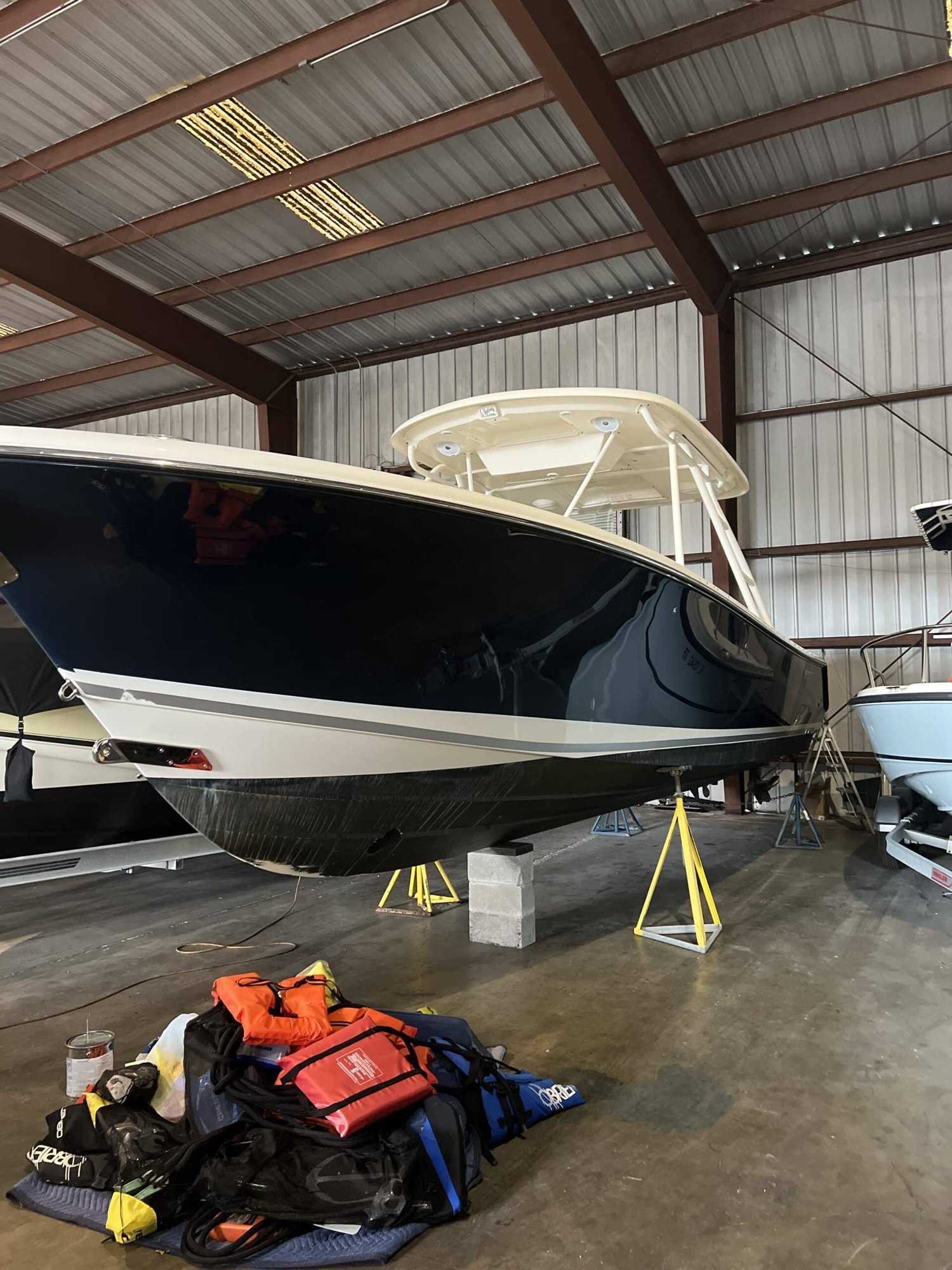 Boat on stands in a covered yard