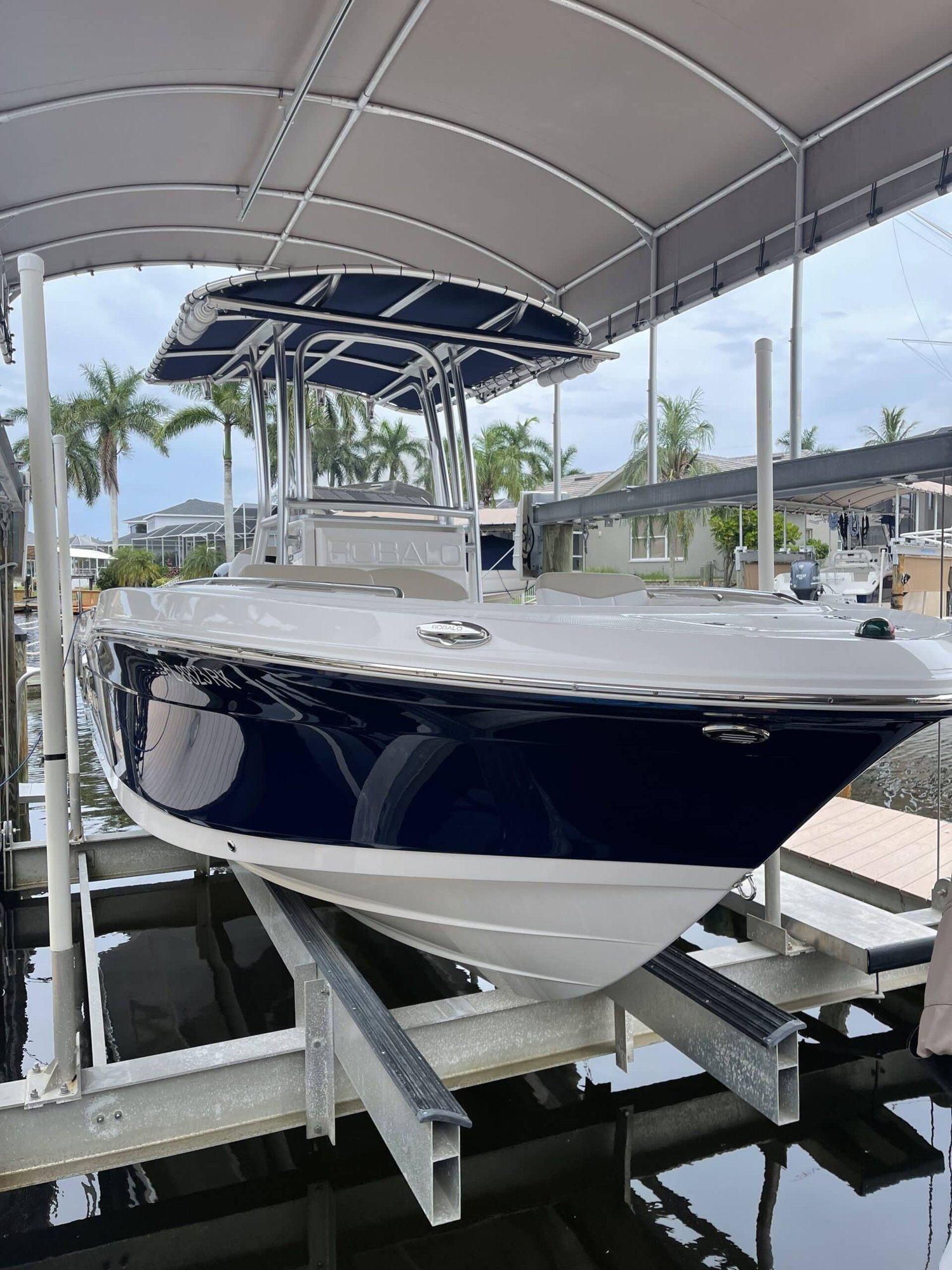Center console on a canal-side boat lift